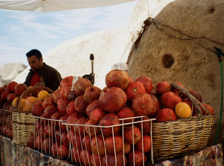 an assortment of fruit in baskets being sold for sale