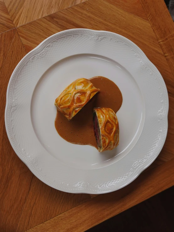 two pastry items are on a white plate