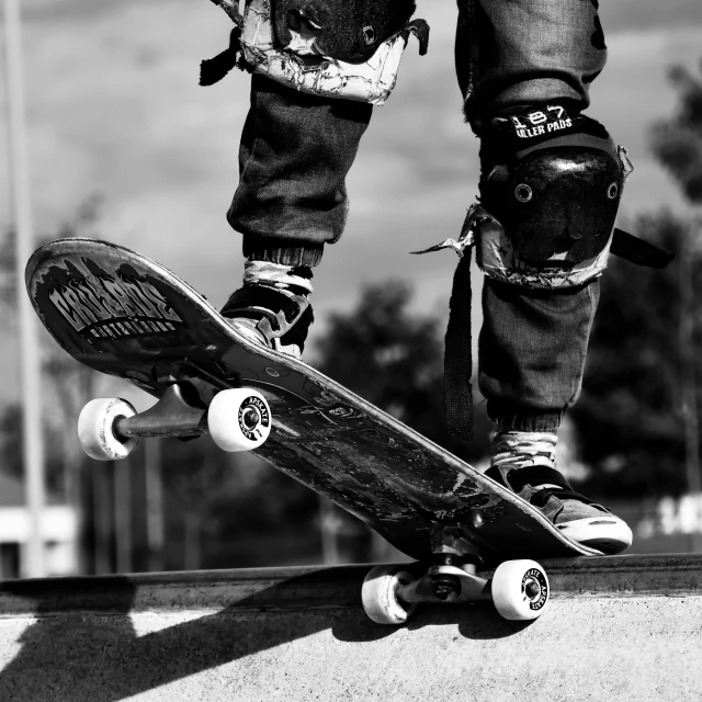 a person riding on a skateboard on top of a ramp