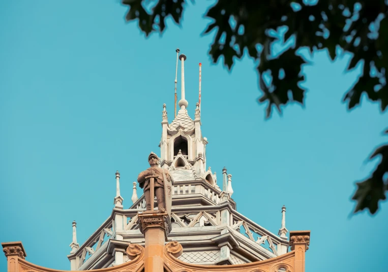 the top part of a building under a blue sky