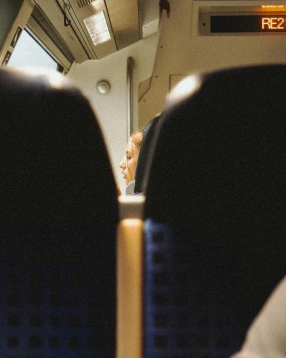 the inside of a train showing its seats and controls