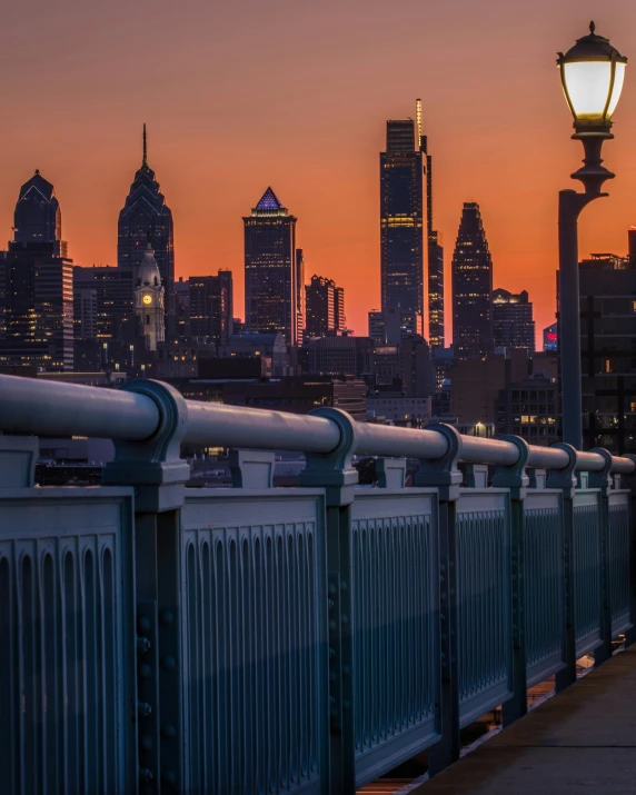 a bridge with railings leading to several light poles