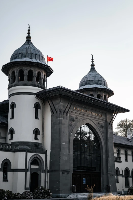 an old building with a gate and many dome roofs