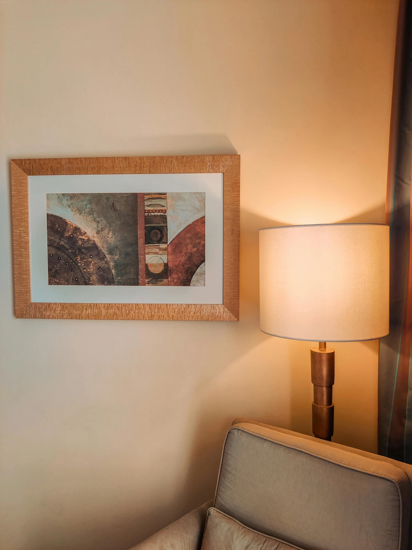 lamp with a picture mounted above it in a living room