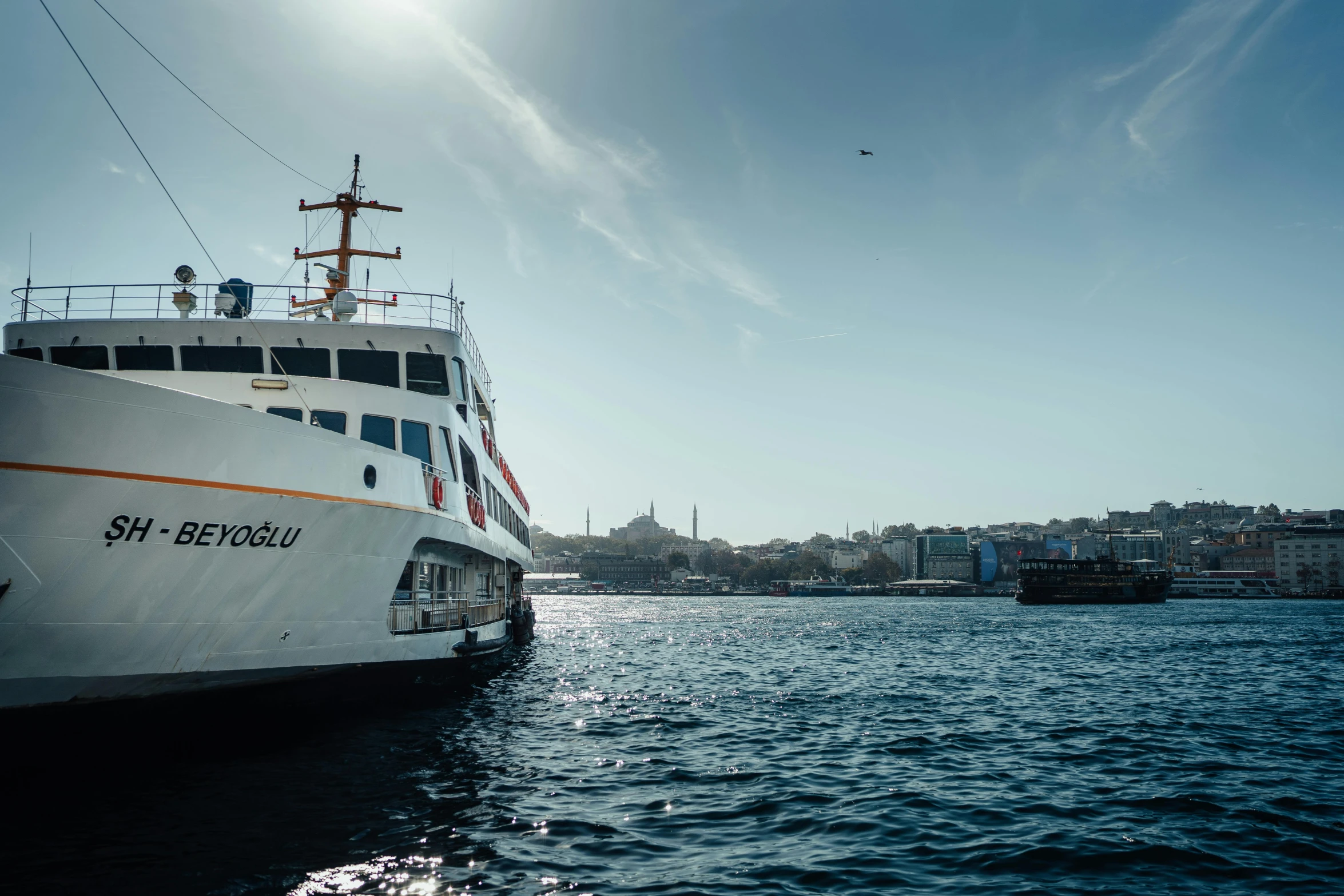 a ship is sitting in the water near some buildings