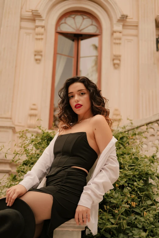 a woman is leaning up on a bench with her foot up