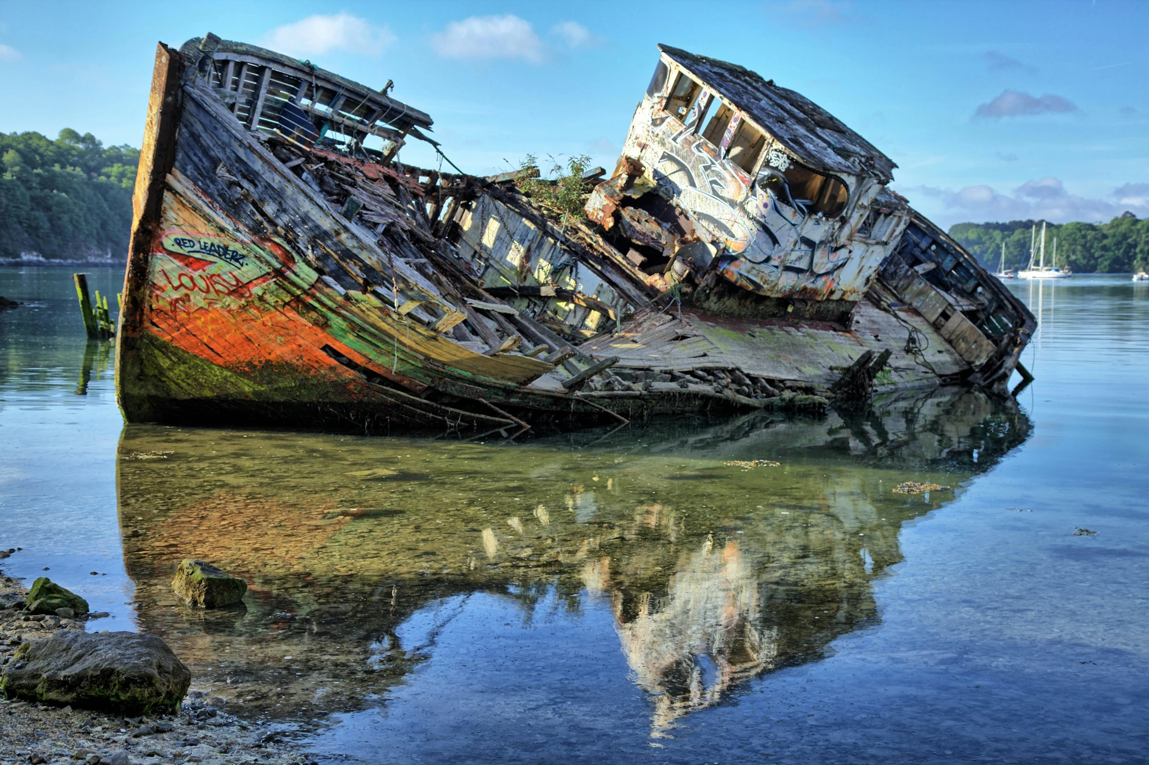 two old boats with no wheels in the water