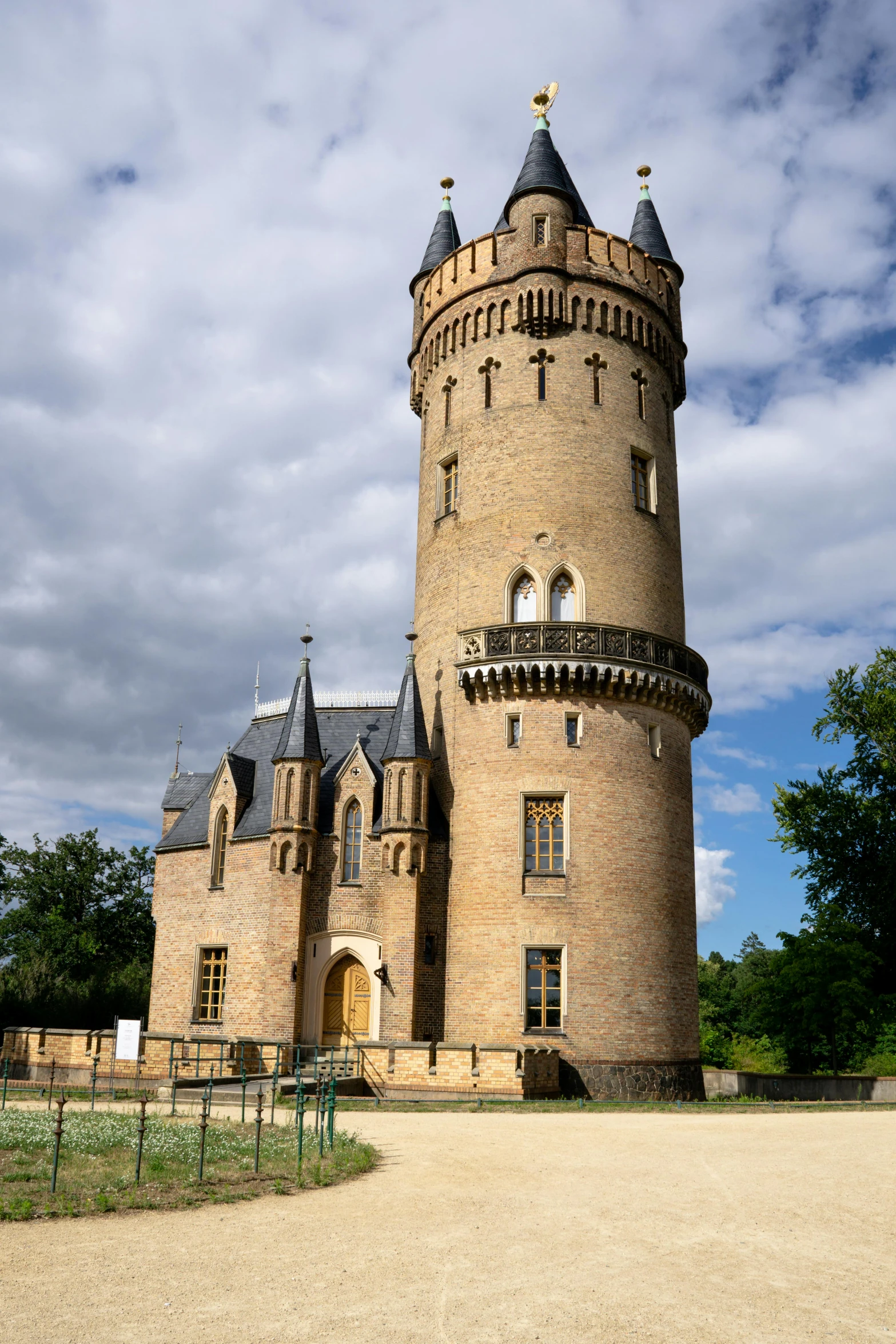 the castle has a lot of towers and a small bridge