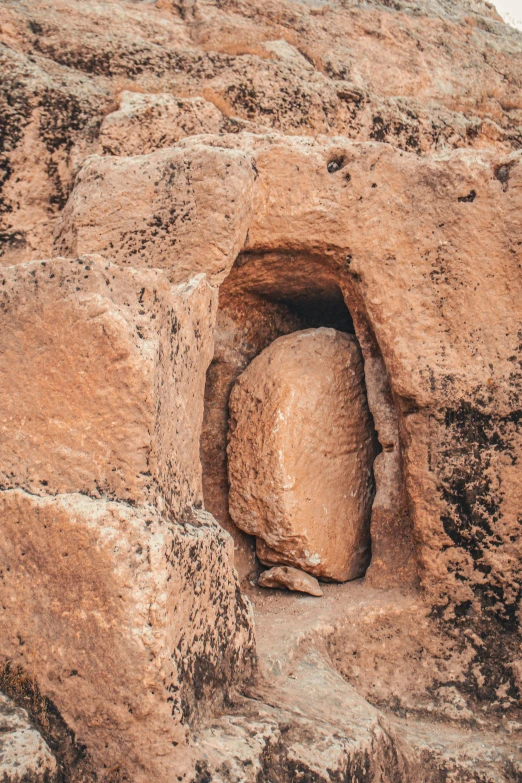 a rock cave in the side of a cliff