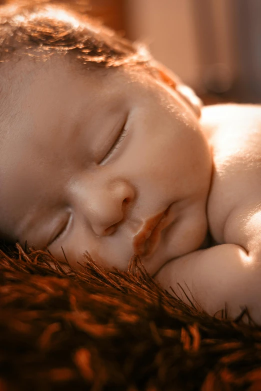 a close - up po of a sleeping baby wearing sun glasses