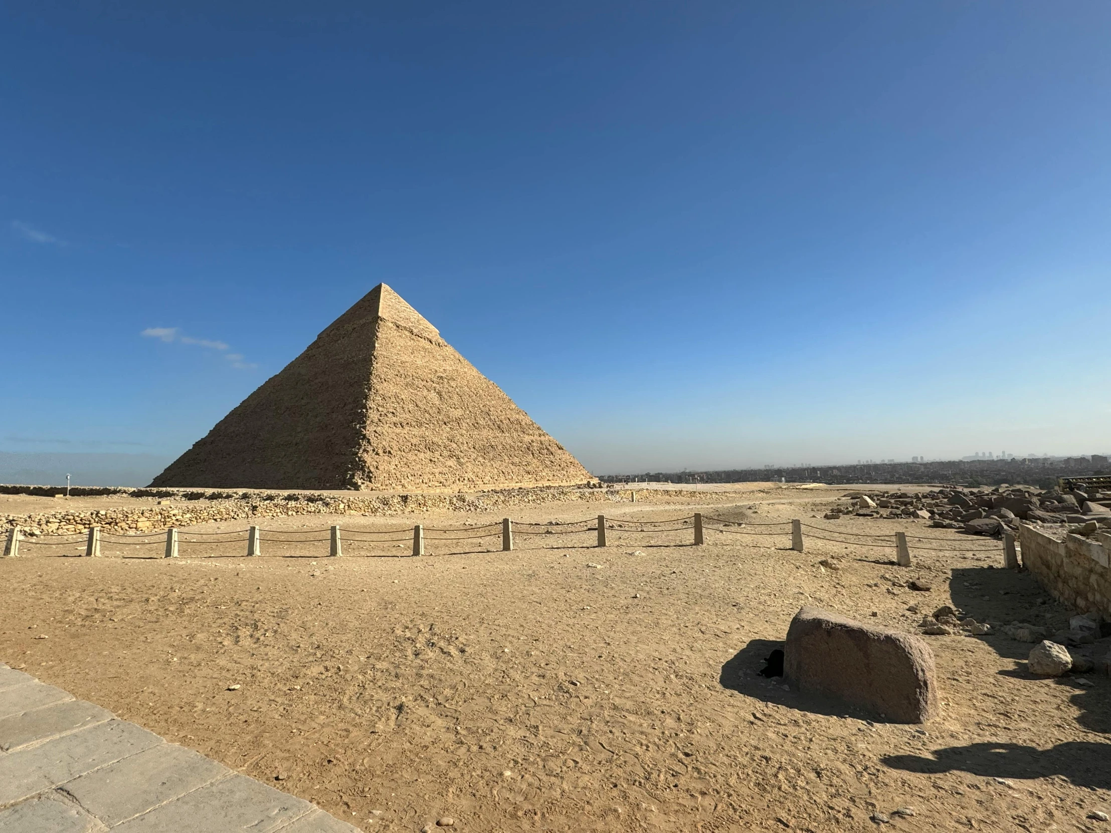 the pyramids of giza seen from across a vast expanse