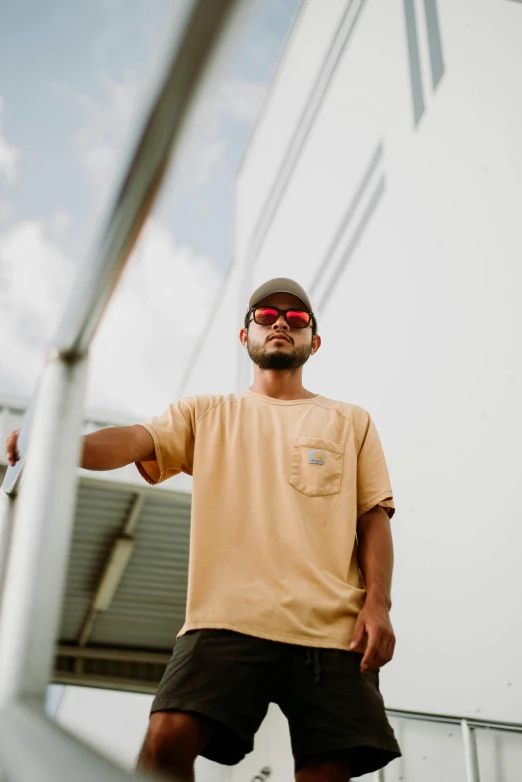 a man with sunglasses on is posing for the camera