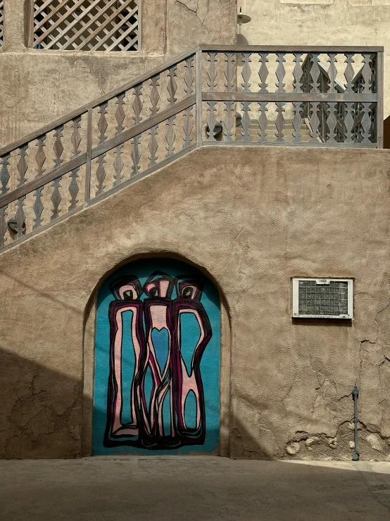 a colorful doorway is on the wall of a building