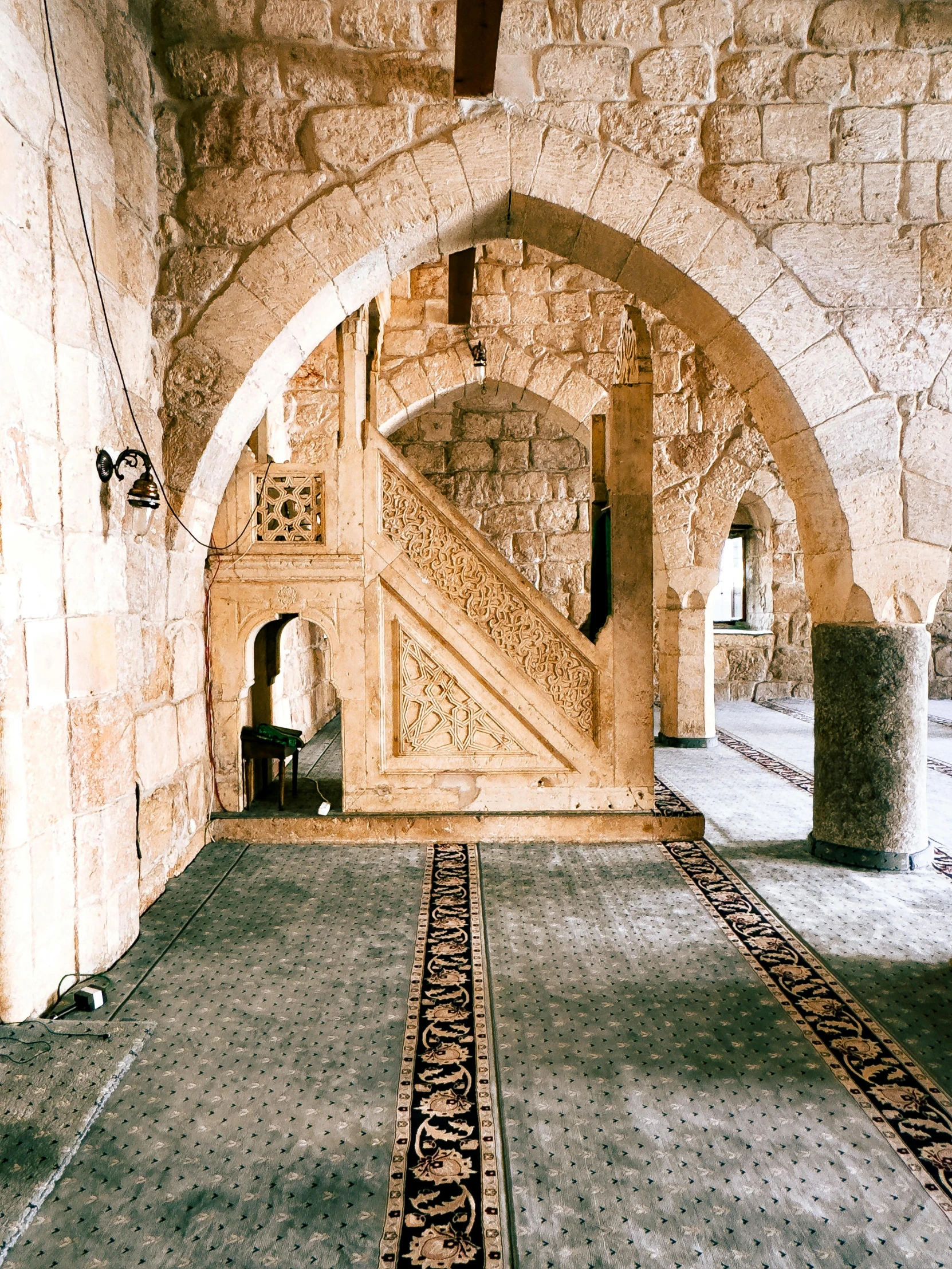 the inside of an old building with stone pillars