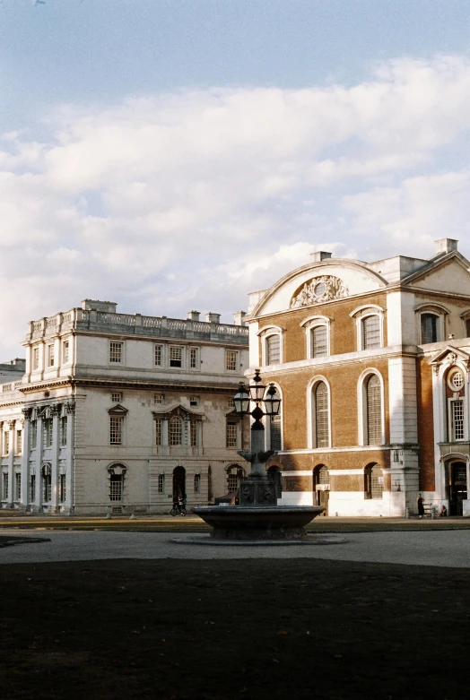 a building with a fountain in the front