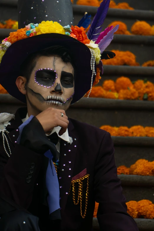 a man with a skeleton makeup painted on is posing