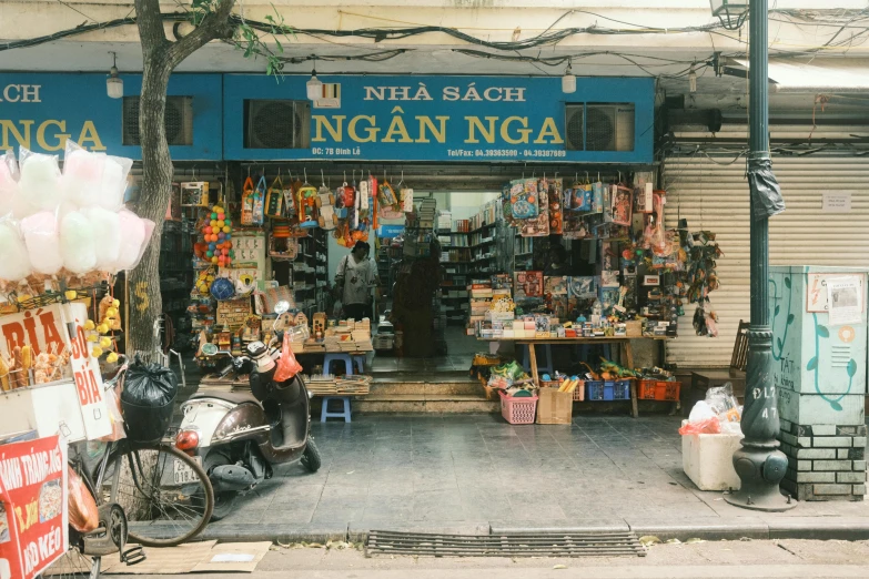 store front with a bicycle in front and bicycles parked outside