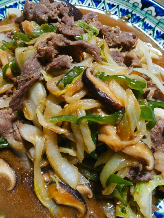 stir fried meat and vegetables on a plate