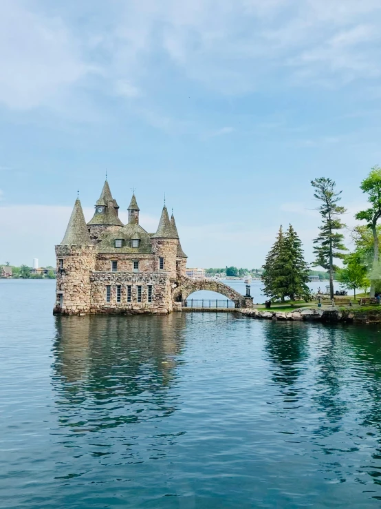 a building sits on a island surrounded by water