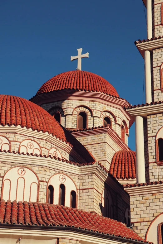 a church steeple with a cross on top