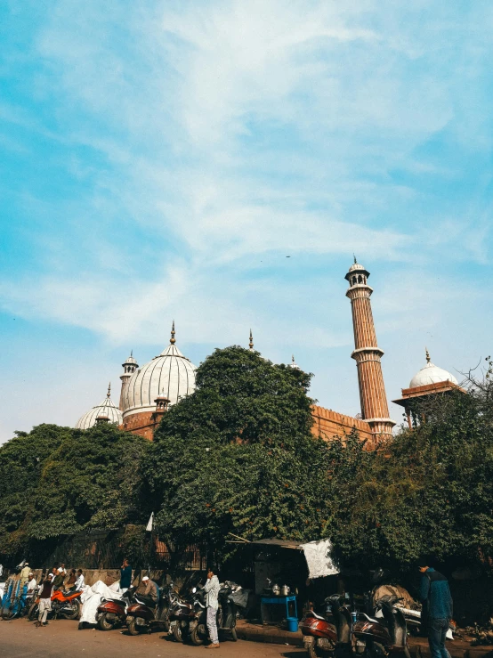 a city square with a tall tower in the background