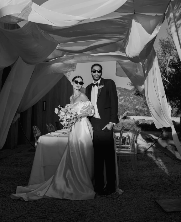 a couple on their wedding day posing for a picture