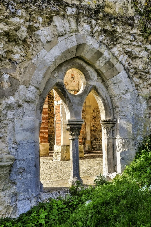 an old and broken building with a clock