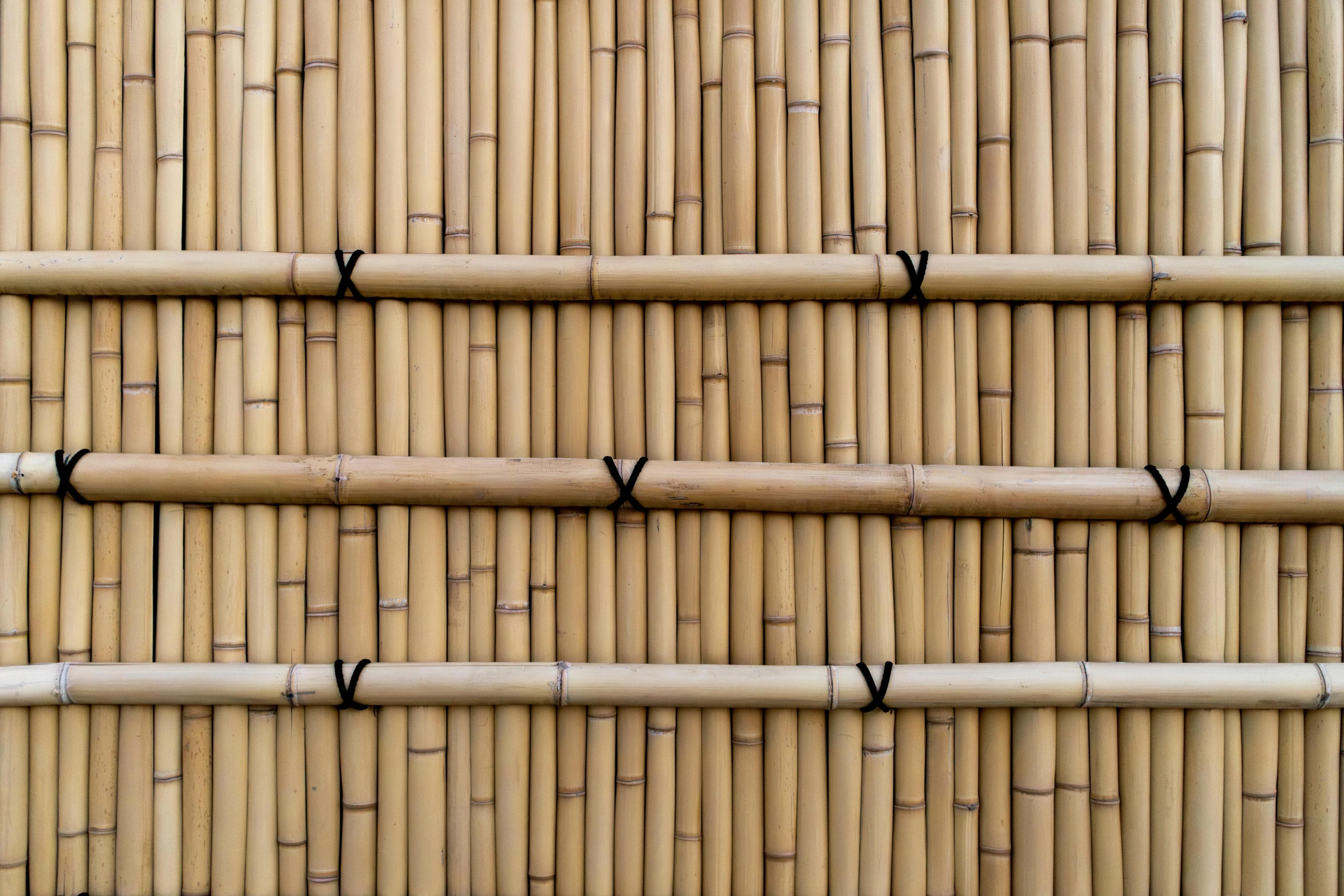 a bamboo table that has some kind of black piping on it