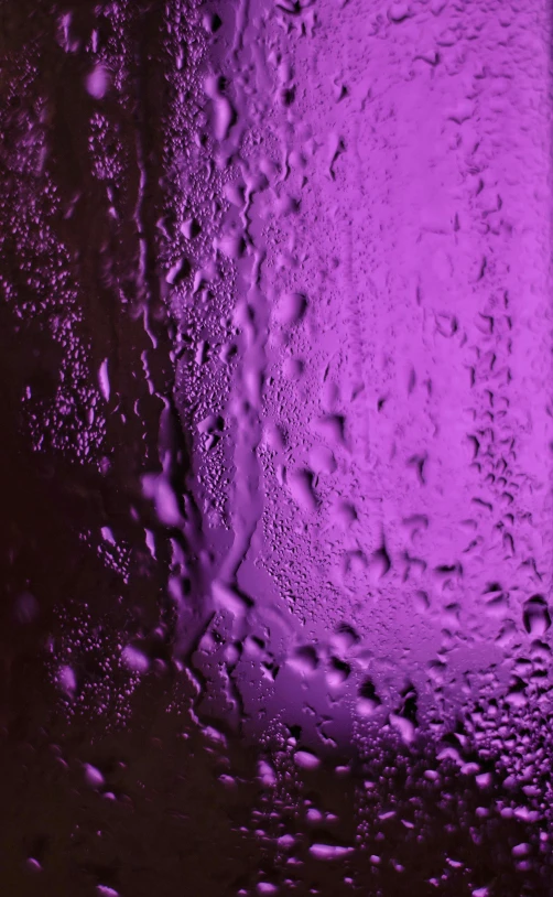 a wet window shows a purple tint