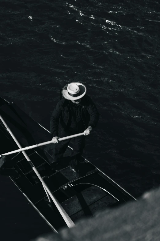 an old po of a person paddling in a canoe