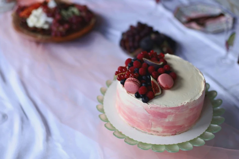 cake on table with fruit toppings on top