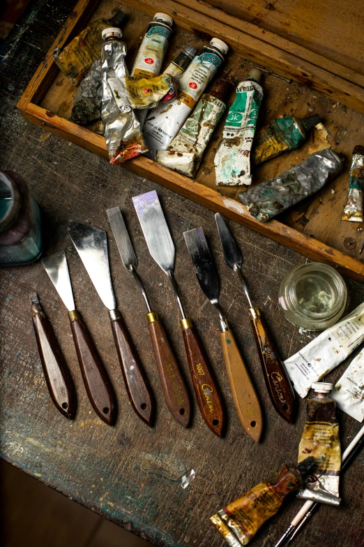 an art project is being done with sharp knives