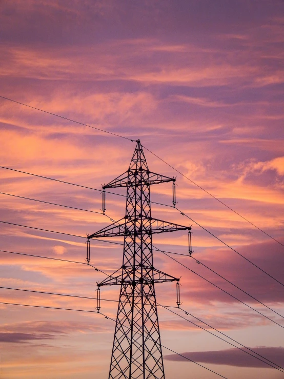 sunset with electricity towers and power lines