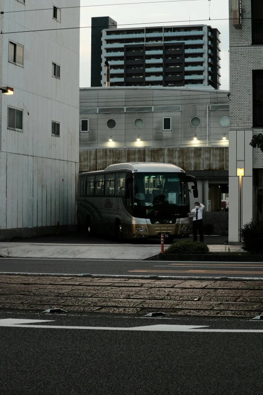 an old bus is driving through the parking lot