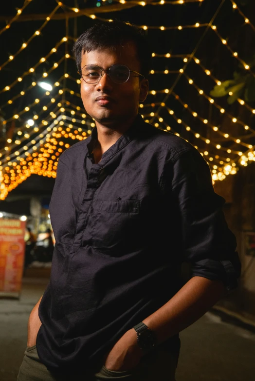 a man standing in front of a lot of lights