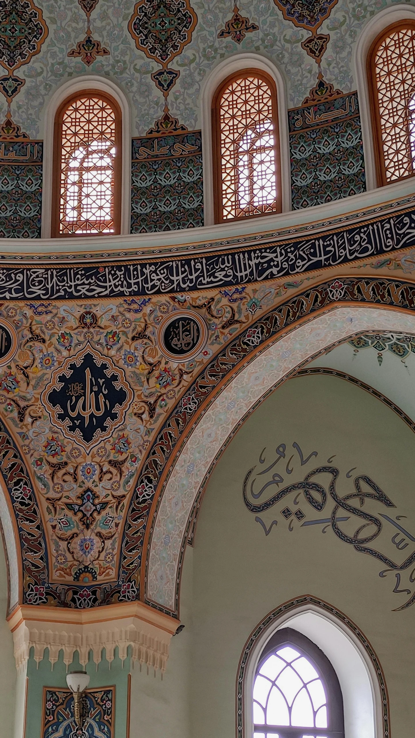 the view looking up at the ceiling of an intricately decorated building