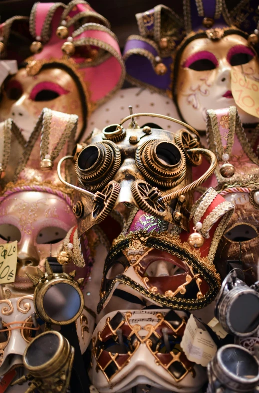 an assortment of masks on display at a carnival