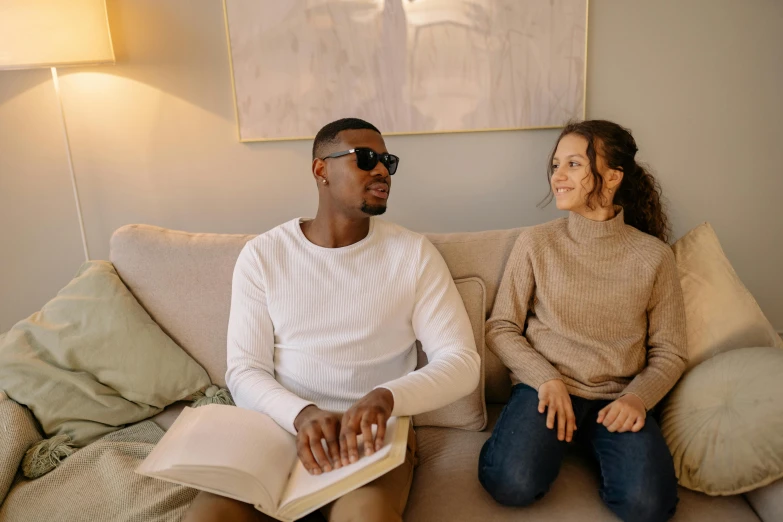 an image of a man and woman on the couch