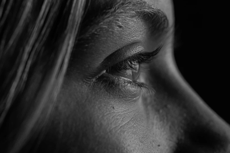 a woman's face is shown, looking ahead