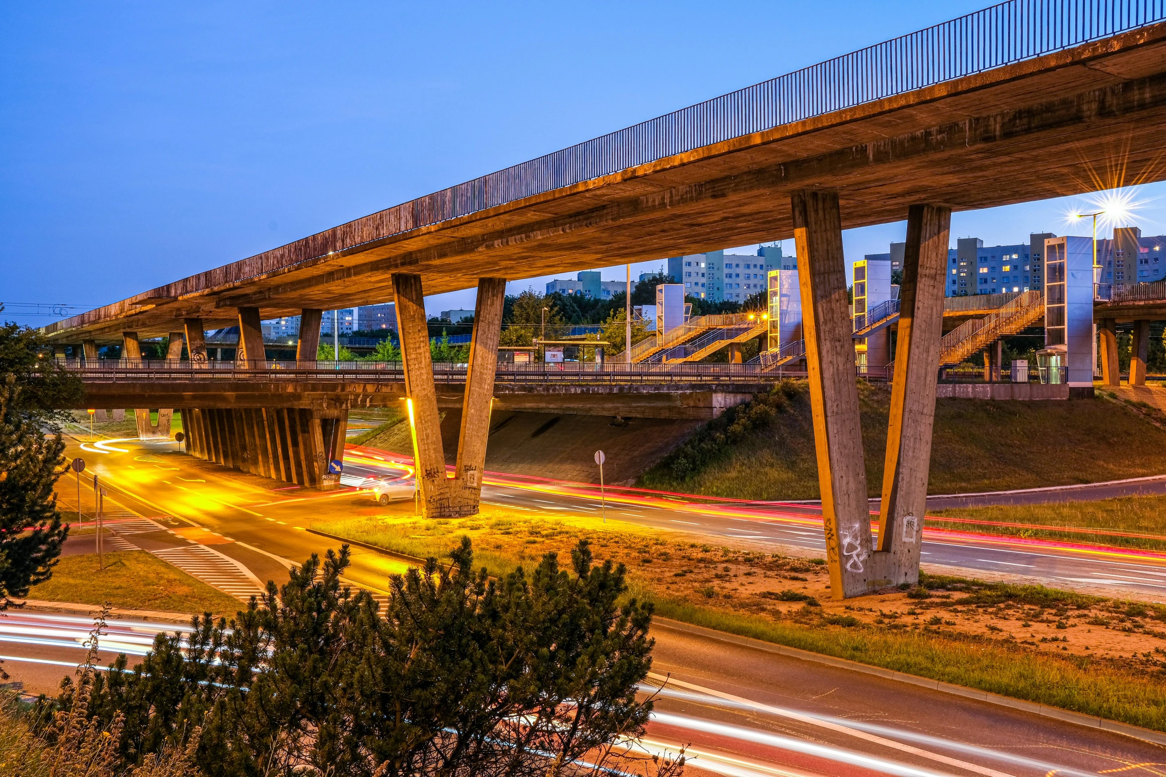 a view of a freeway with cars driving on it at night