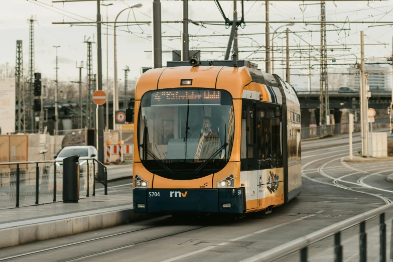 there is an electric train on the train tracks