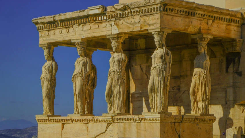 some ancient stone statues standing near each other