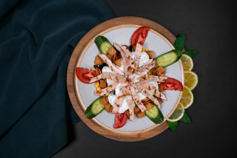 salad on plate with cucumber, tomato, and lettuce