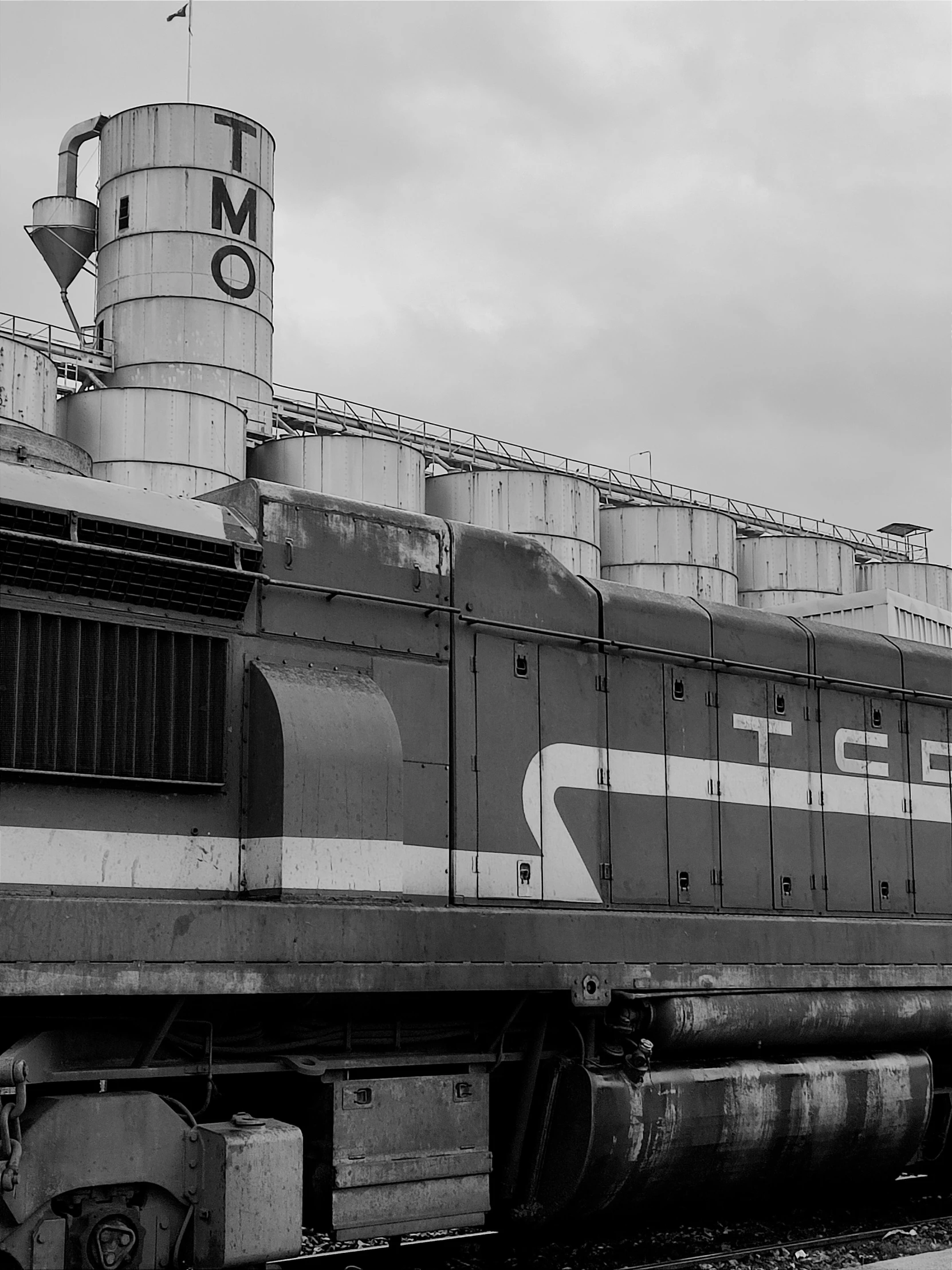 a old locomotive sits alone in the railway