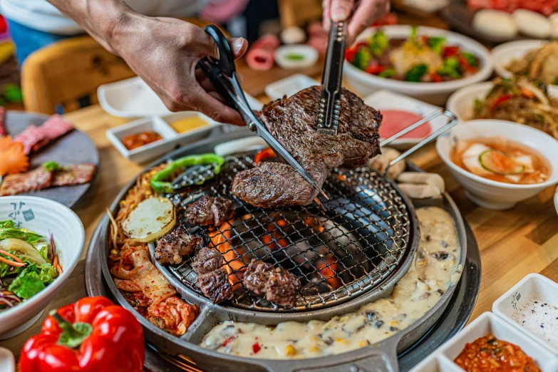 this is a person cooking on a grill outside