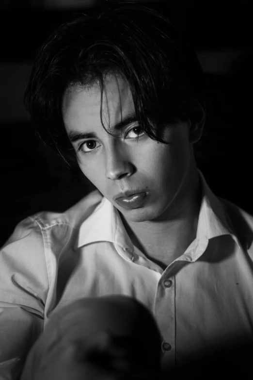 black and white pograph of a boy looking angry