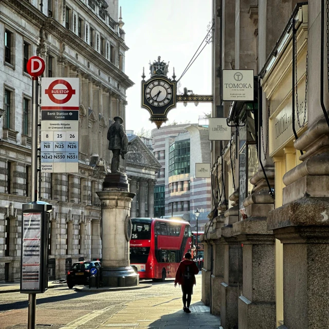 a person walks down the street in a european city