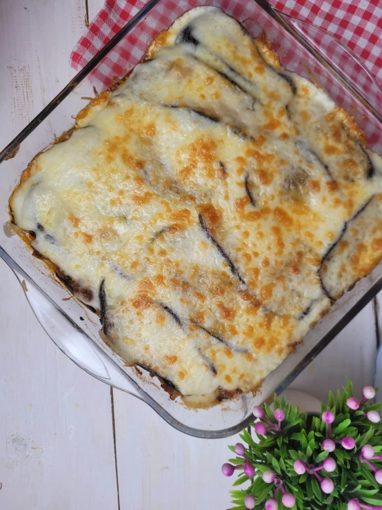 some food is sitting in a casserole dish