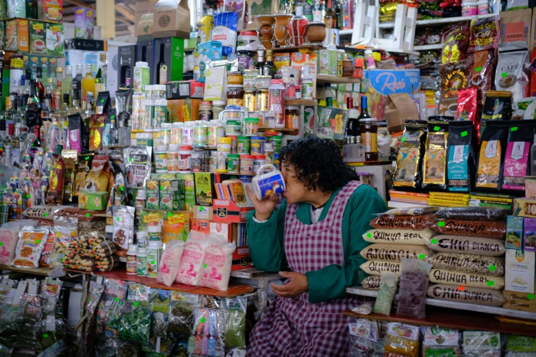 a storekeeper shops for spices at a marketplace