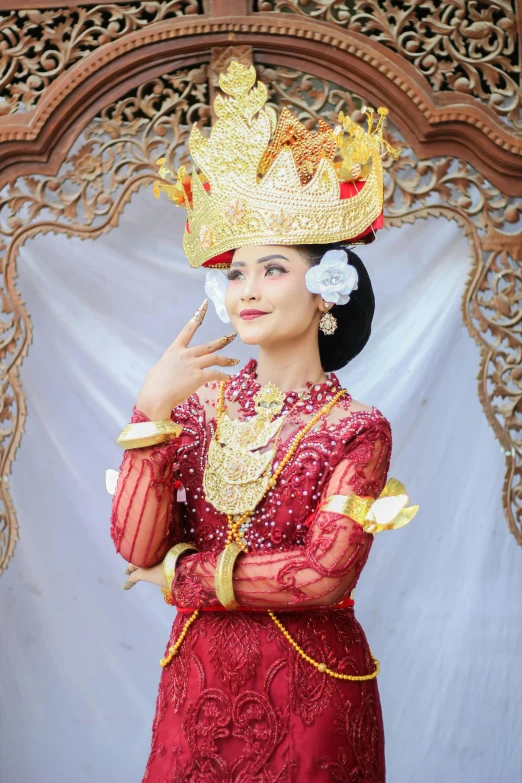 an oriental woman is wearing the traditional thai princess costume